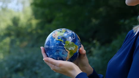 hands holding a globe: symbol of global responsibility and environmental care
