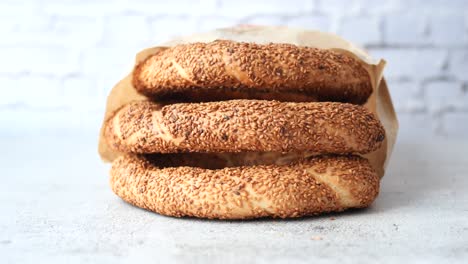 stack of turkish bagels (simit) in a paper bag