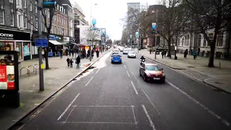 London-city-in-england-time-lapse-from-the-top-of-a-double-decker-bus-following-stop-and-start-busy-traffic