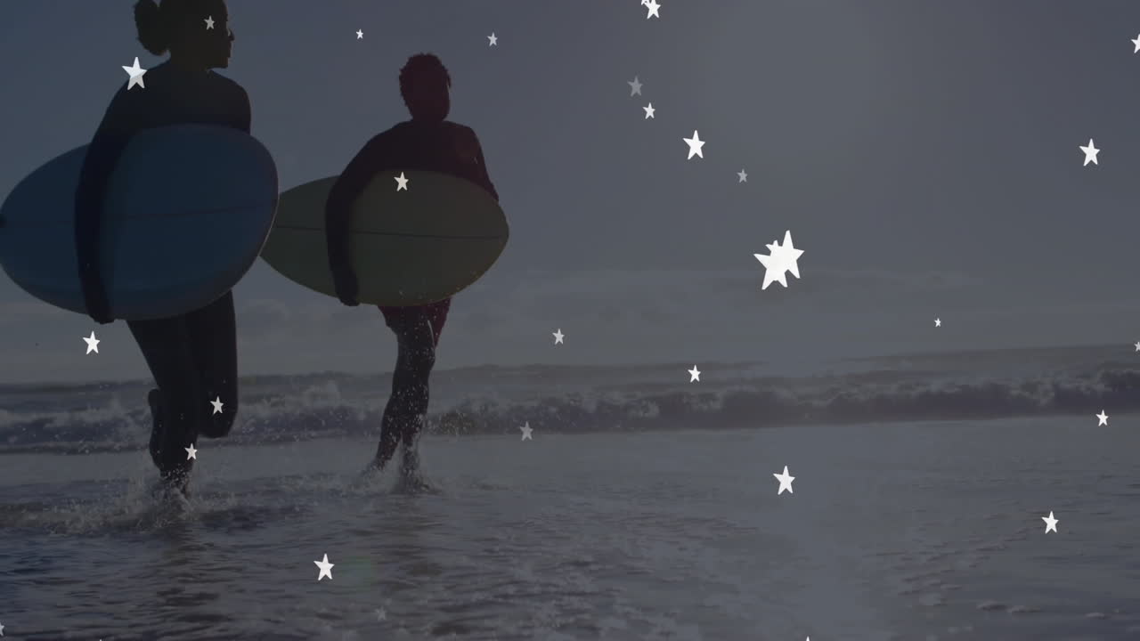 woman and man carrying surfboards heading to shore, star graphic fueling marketing