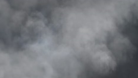 a thunderstorm that took place behind a thick, moving cumulonimbus cloud