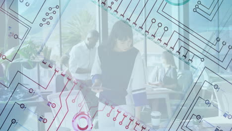 Circuit pattern animation over diverse professionals working in modern office
