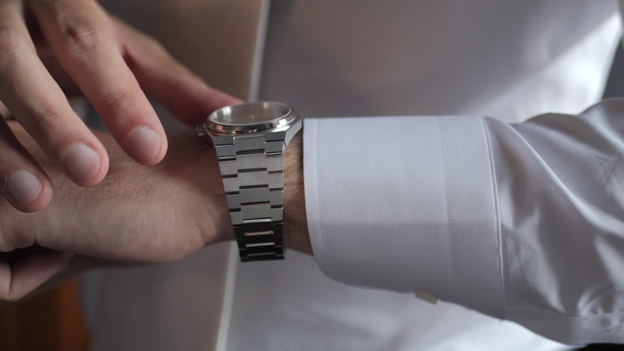 Gentleman Wearing Tie, Trying Luxury Watch On His Wrist