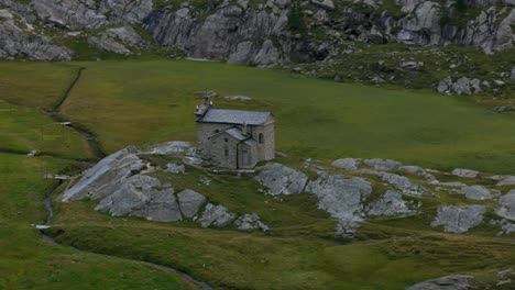 aerial drone view of alpe prabello small church at pizzo scalino of valmalenco in northern italy