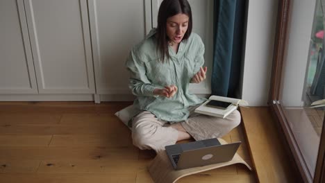 woman in online video meeting from home