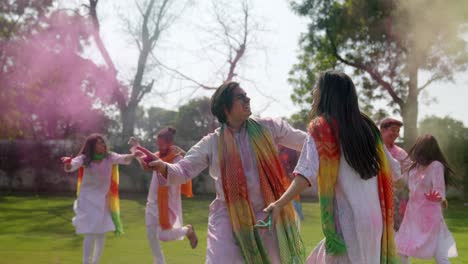 indian people throwing colors in air at a holi festival