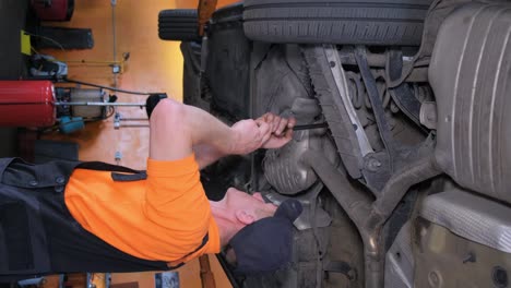 mechanic working on a car in an auto repair shop
