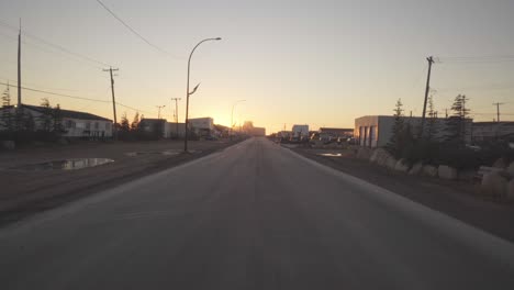 a street in churchill, manitoba, near hudson bay, in canada at sunset.