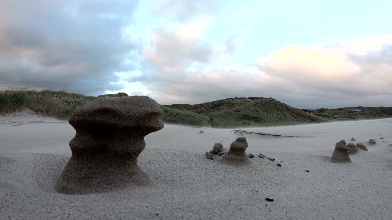 Sand dunes with dune grass in the storm of the North Sea, hiking dunes, dike protection, Sondervig, Jutland, Denmark, 4k