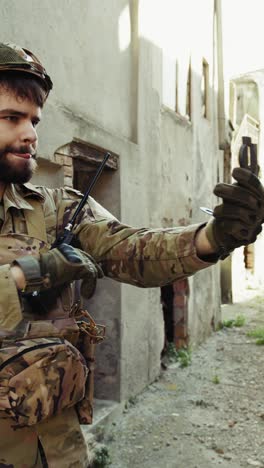 soldier gets lost during war and checks his compass in the city