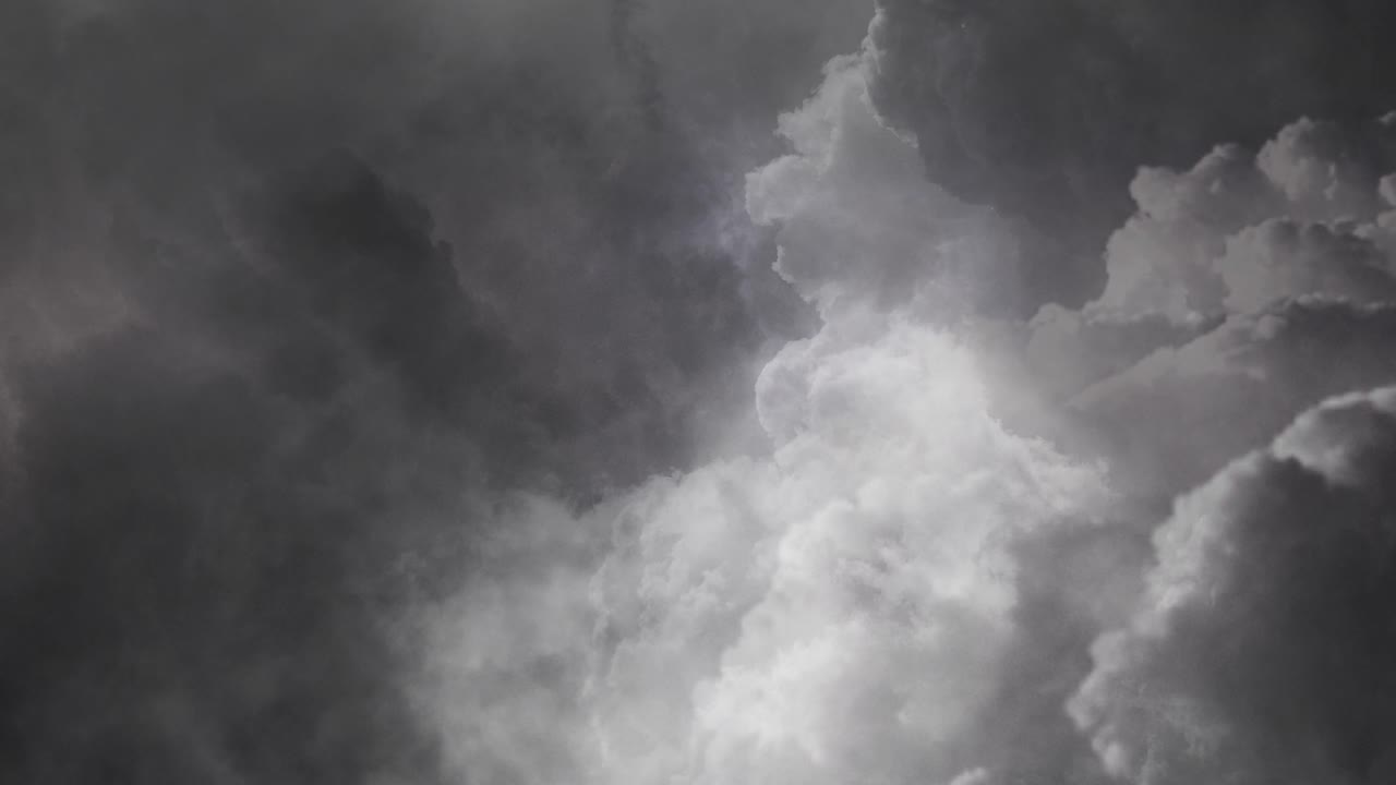thunderstorm, thick dark clouds in the sky with flashes