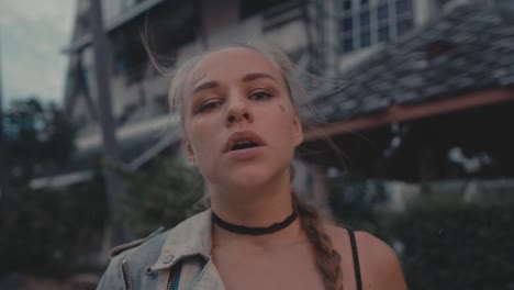 young woman smoking outdoors