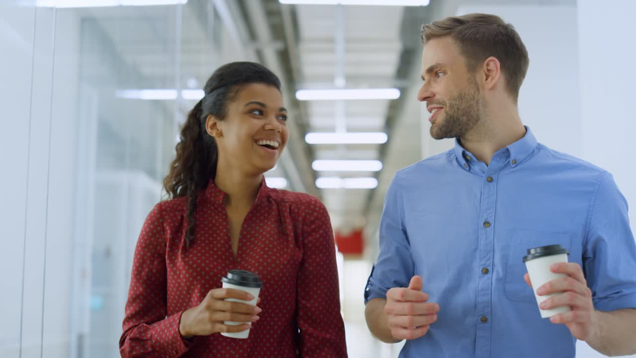 Business couple talking in coworking