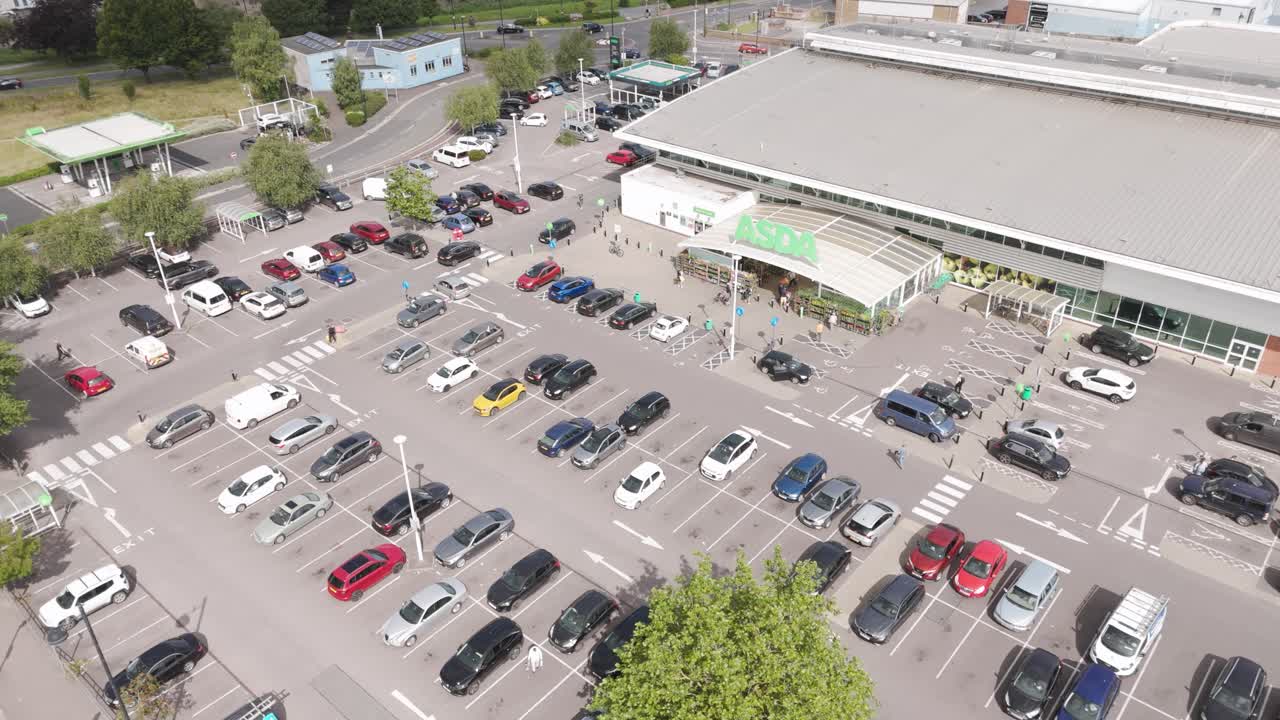 Aerial view of an ASDA supermarket with a busy parking lot