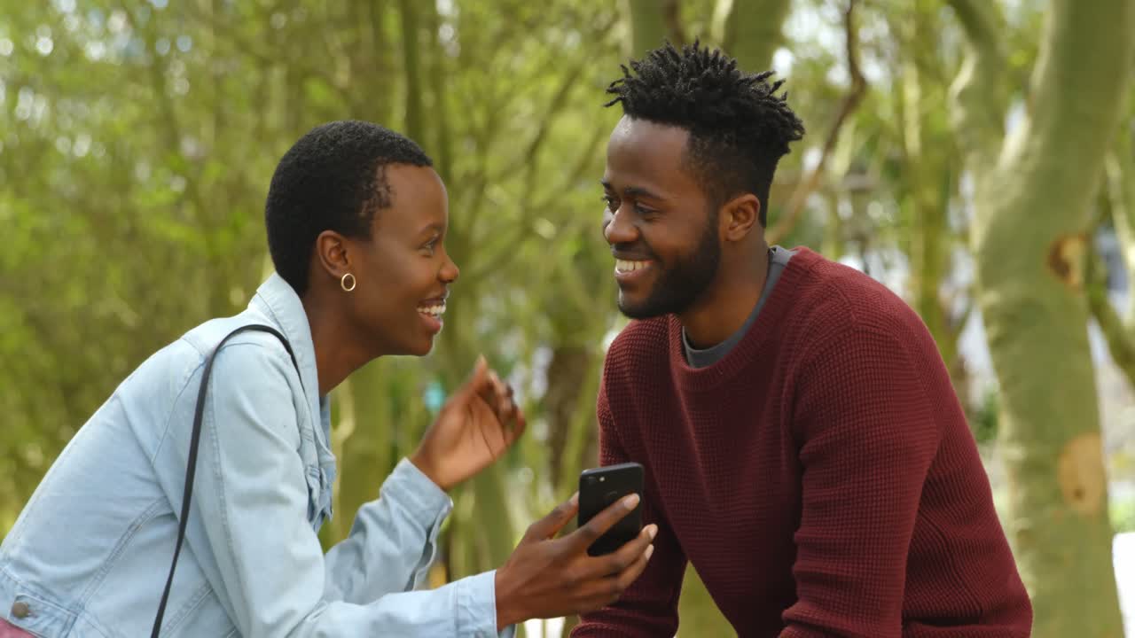 Couple using mobile phone 4k