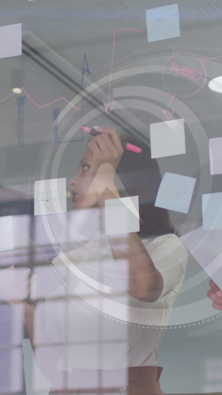 Animation of clock over diverse business people taking notes