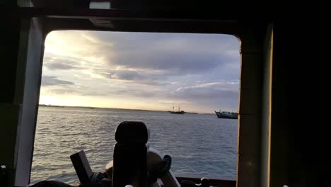 Shot-of-dive-deck-with-tanks-and-regulators-and-sunshine-in-the-morning-on-a-Phinisi-liveaboard-in-Misool,-Raja-Ampat,-Indonesia,-Asia