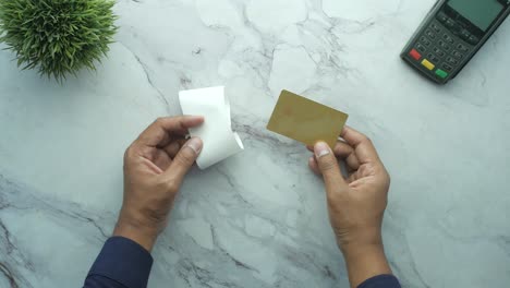 Close-up-of-person-hand-holding-credit-card