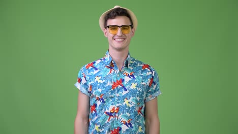 young happy handsome tourist man smiling
