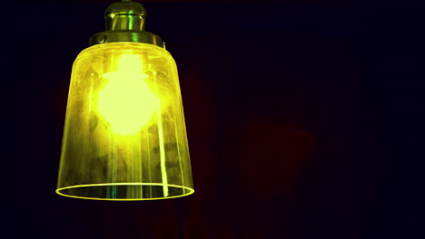 yellow light bulb in the dark room