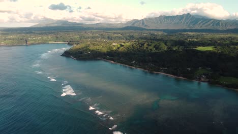 cinematic arial view over anini beach, kauai, hawaii