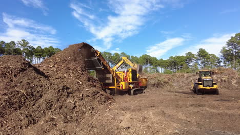 Big-machines-grinding-yard-debris-into-mulch