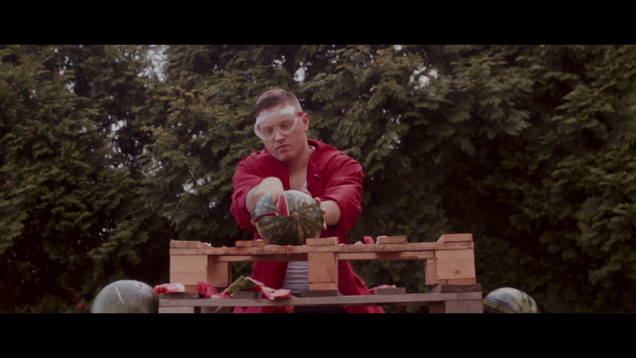 Man Smashes Watermelon with a Knife