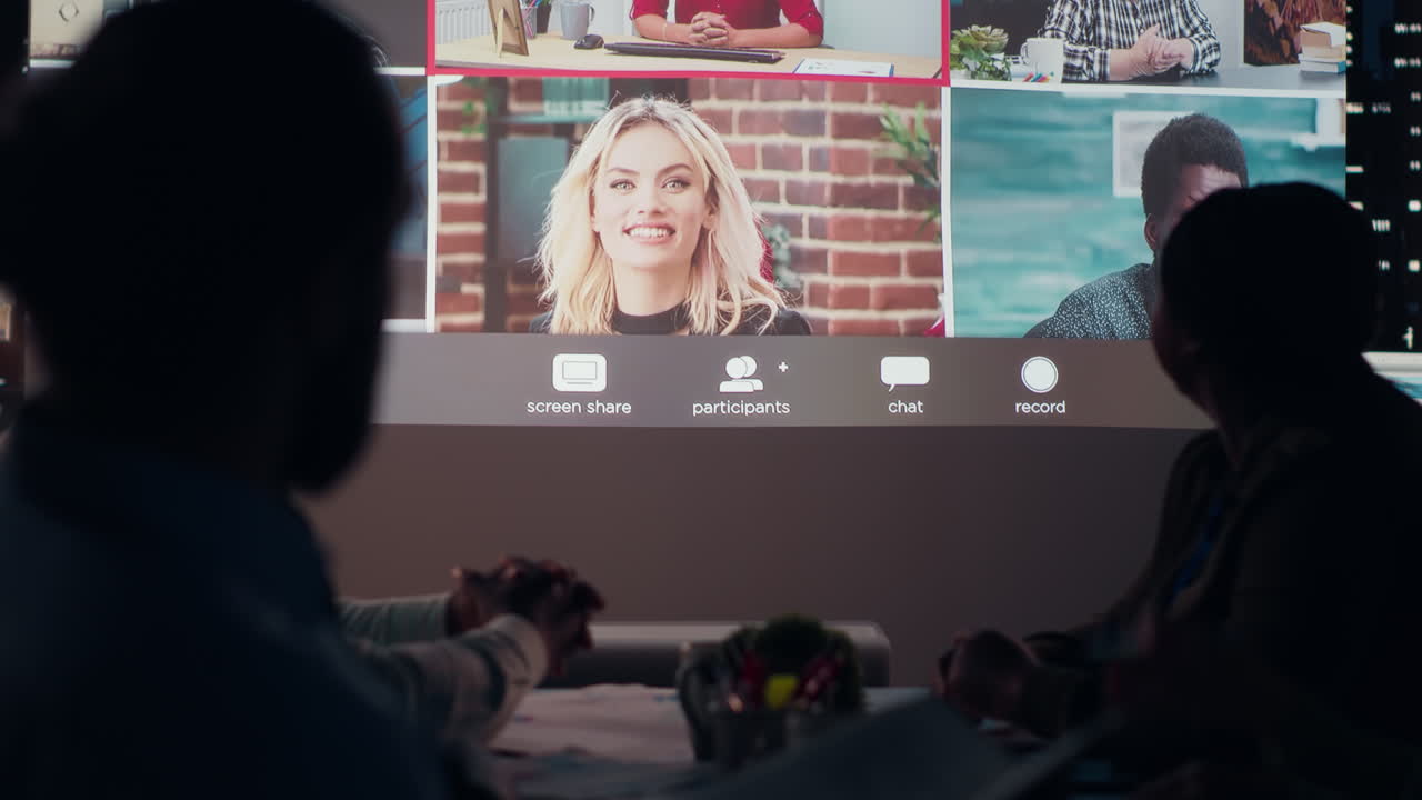 Multiethnic group attends a digital meeting from the office at night