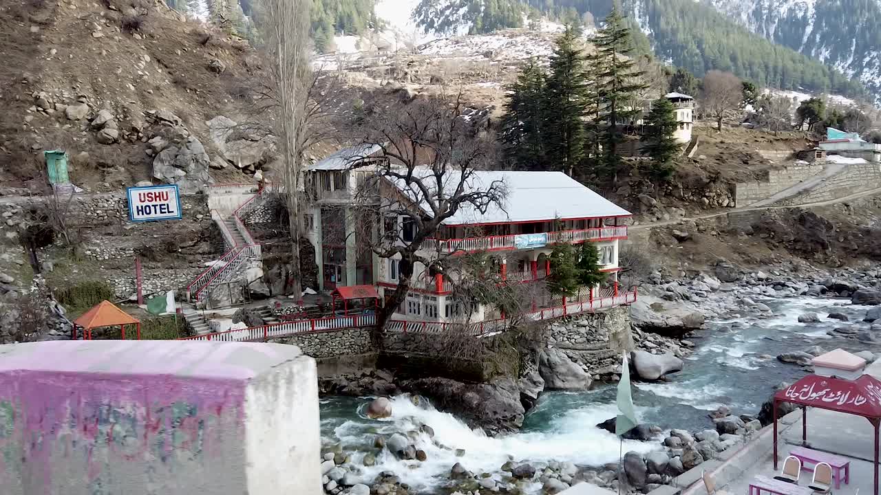 Scenic Ushu Hotel by the River in Winter