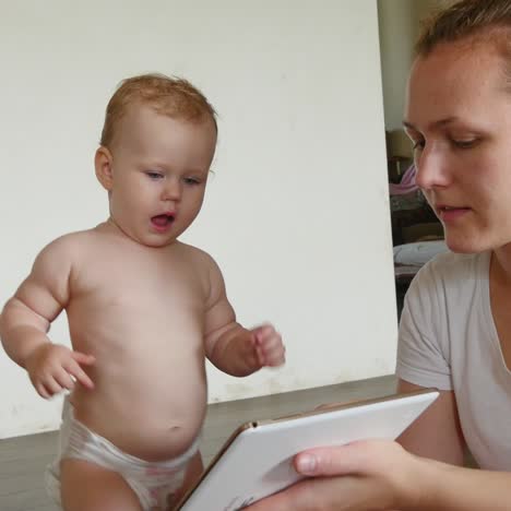 family wiht tablet at floor