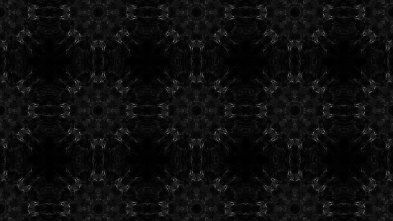 Kaleidoscope on black background with changing shapes smoky animation