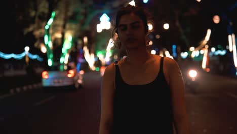 cinematic portrait shot of a girl standing in the middle of the road, looking cool and confident into the camera