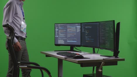 programmer working on a dual monitor setup