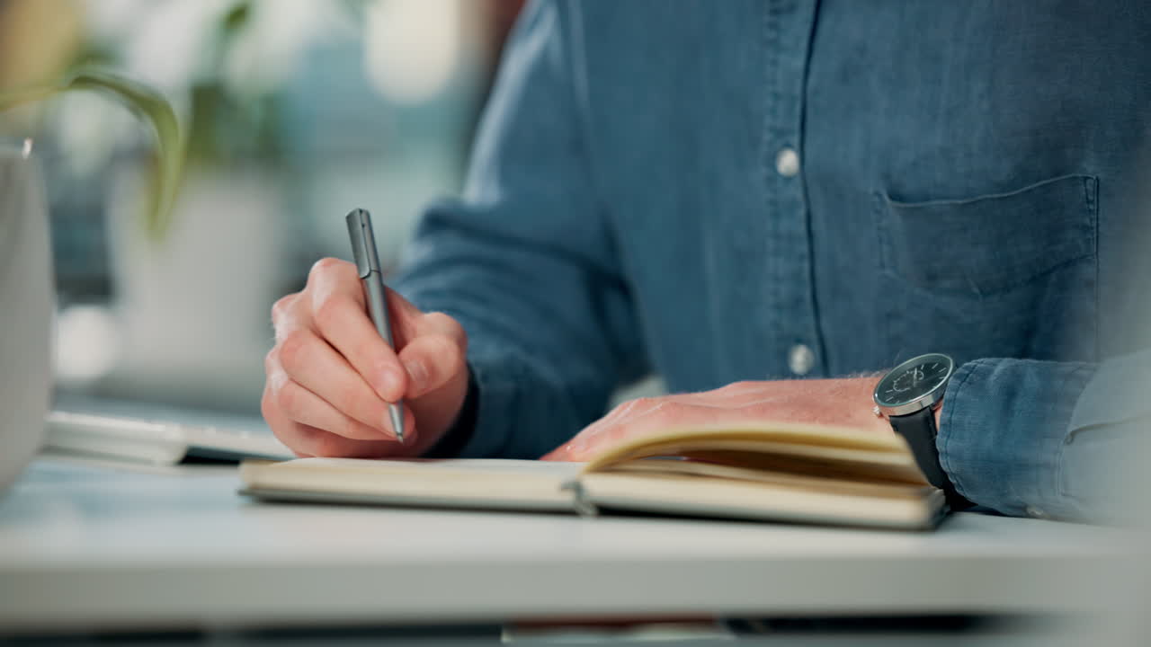 Man writing in notebook