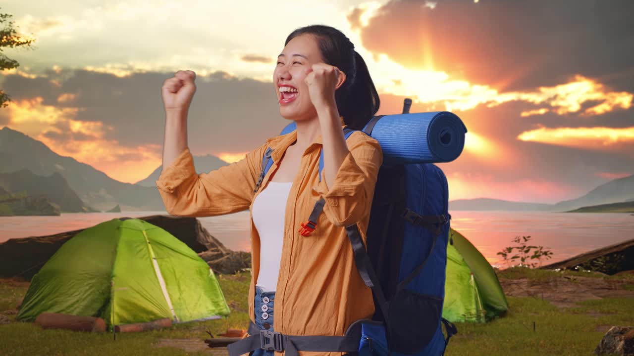 Excited Woman Camping at Sunrise