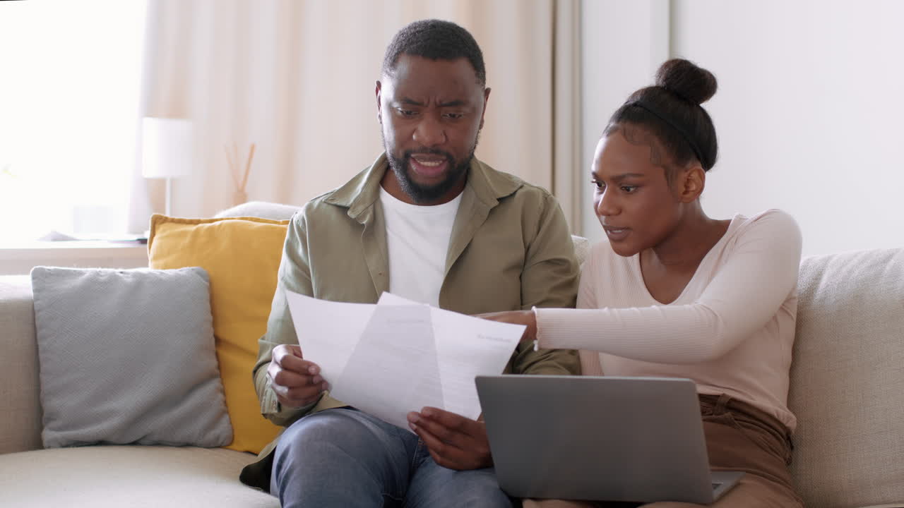 Couple Discussing Bills at Home