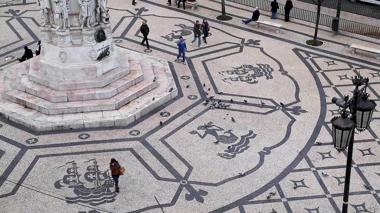Wide shot of Portuguese cobblestones at Praca Camoes in the center of Lisbon, Portugal.