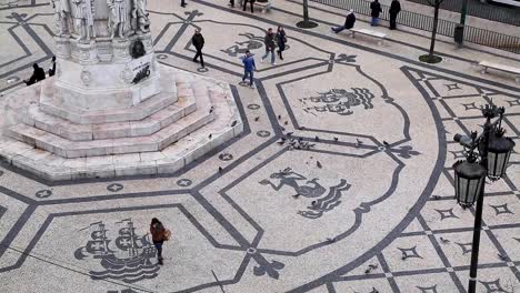 wide shot of portuguese cobblestones at praca camoes in the center of lisbon, portugal.