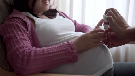 pregnant couple feels love and relax at home.