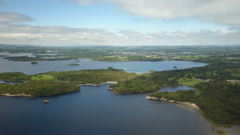 full sweeping panorama of a series of lakes surrounded by coniferous oaktrees and limestone rock