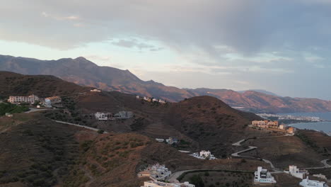 Tracking-shot-from-right-to-left-revealing-mountains-and-sea