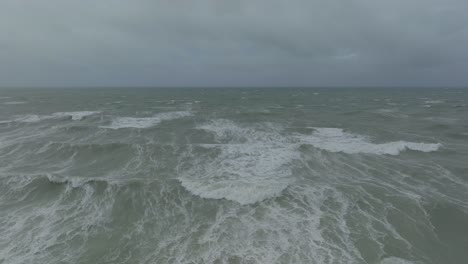 big waves coming in from the english channel towards the french village ambleteuse