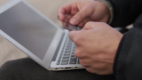 young man making online purchases