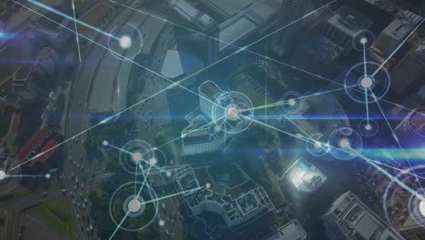 network of connections and data processing animation over aerial view of cityscape