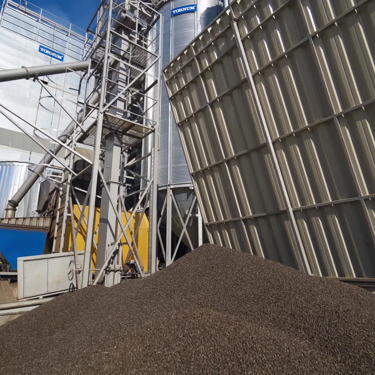 Huge metal grain silos. Silver silos for drying cleaning and storage of agricultural products
