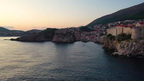 beautiful dubrovnik coastal old town at sunset, croatia, aerial arc shot
