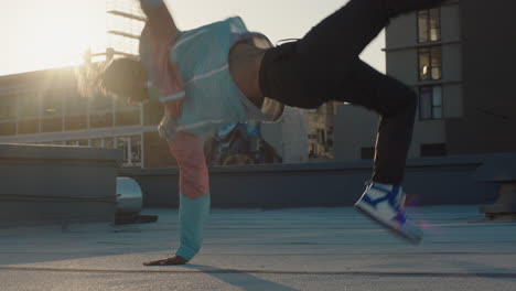 dancing-man-breakdancing-on-roof-top-hip-hop-dancer-practicing-dance-routine-performing-freestyle-moves-in-city-at-sunset