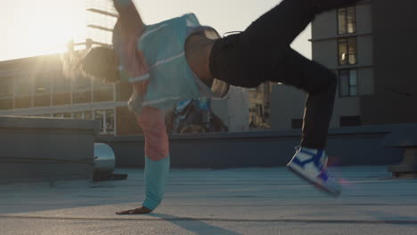 dancing man breakdancing on roof top hip hop dancer practicing dance routine performing freestyle moves in city at sunset