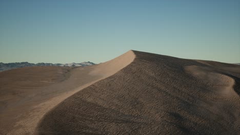 aerial view on big sand dunes in sahara desert at sunrise