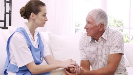 senior man talking to nurse